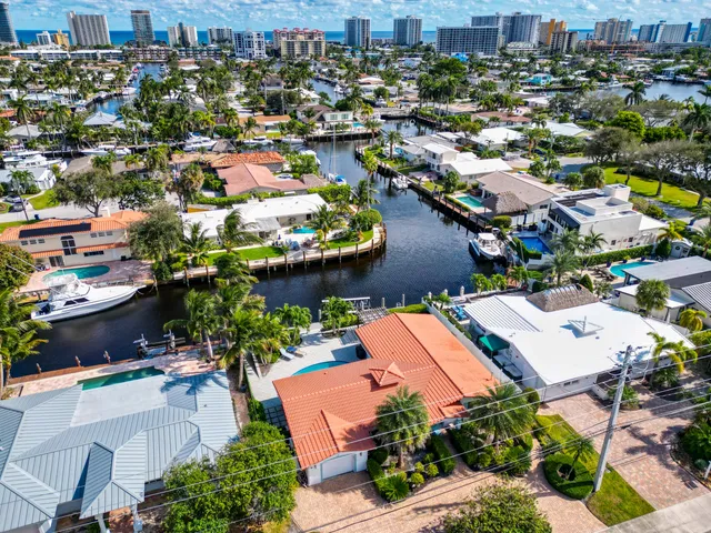 an aerial view of residential houses with outdoor space