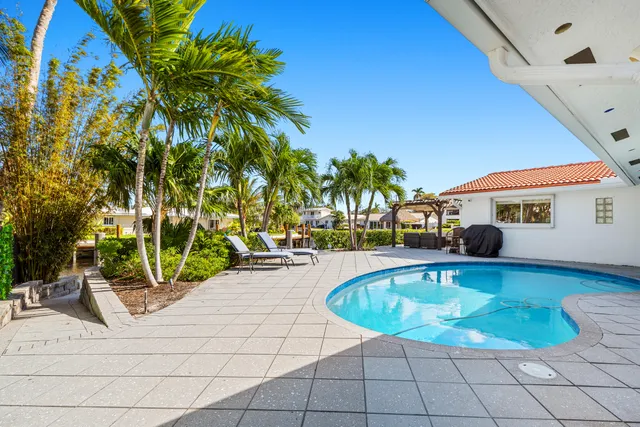 a view of a swimming pool with a patio
