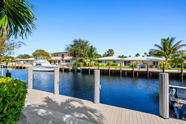 a front view of a house with a yard and a garage
