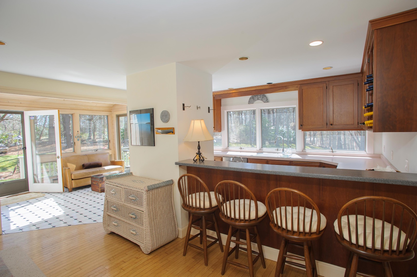 237 Lagoon Pond Road Vineyard Haven, MA 02568 - Photo 9 of 21 a kitchen with granite countertop a sink chairs and granite counter tops