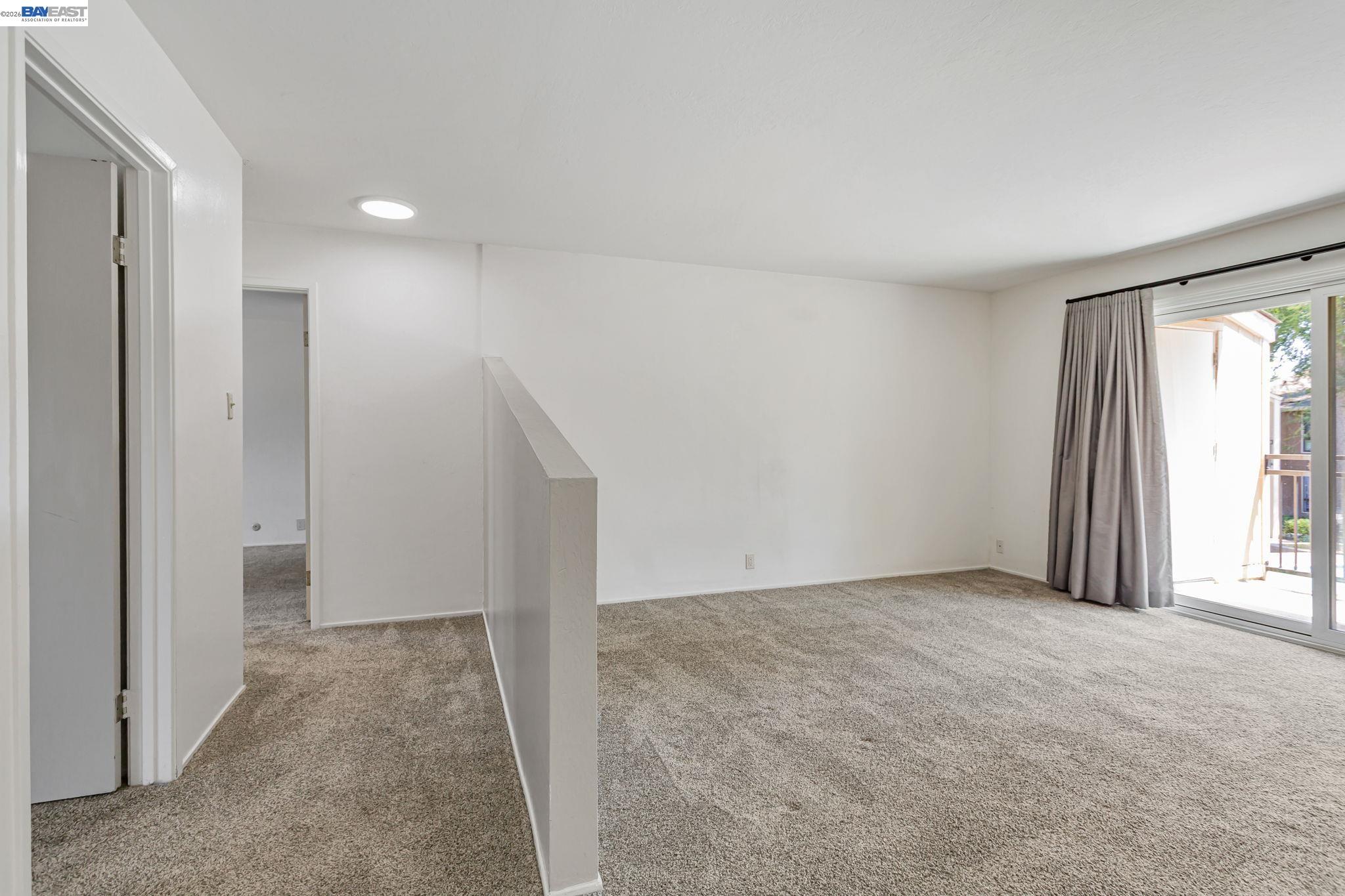 8975 Alcosta Boulevard, Unit 104 San Ramon, CA 94583 - Photo 9 of 42 Living room looking down the hall toward the bedrooms