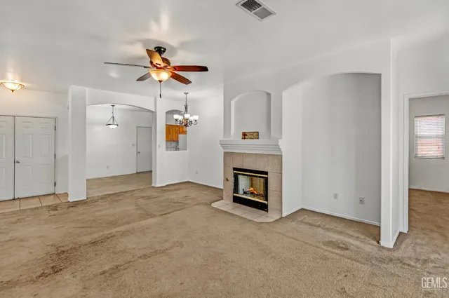 a view of a livingroom with a chandelier fan