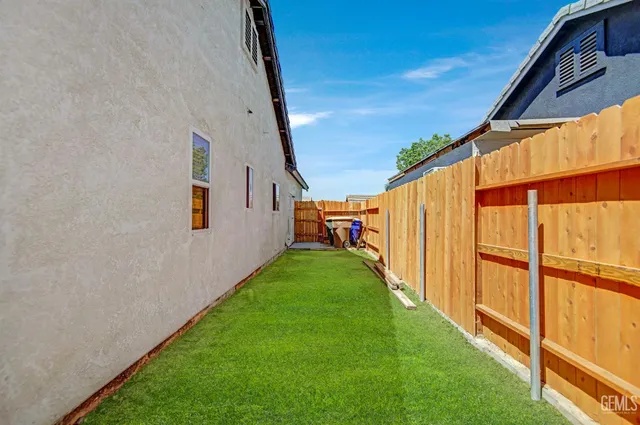 a view of yard with patio
