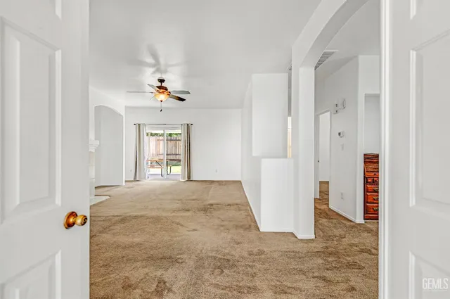 a view of a livingroom with wooden floor and window