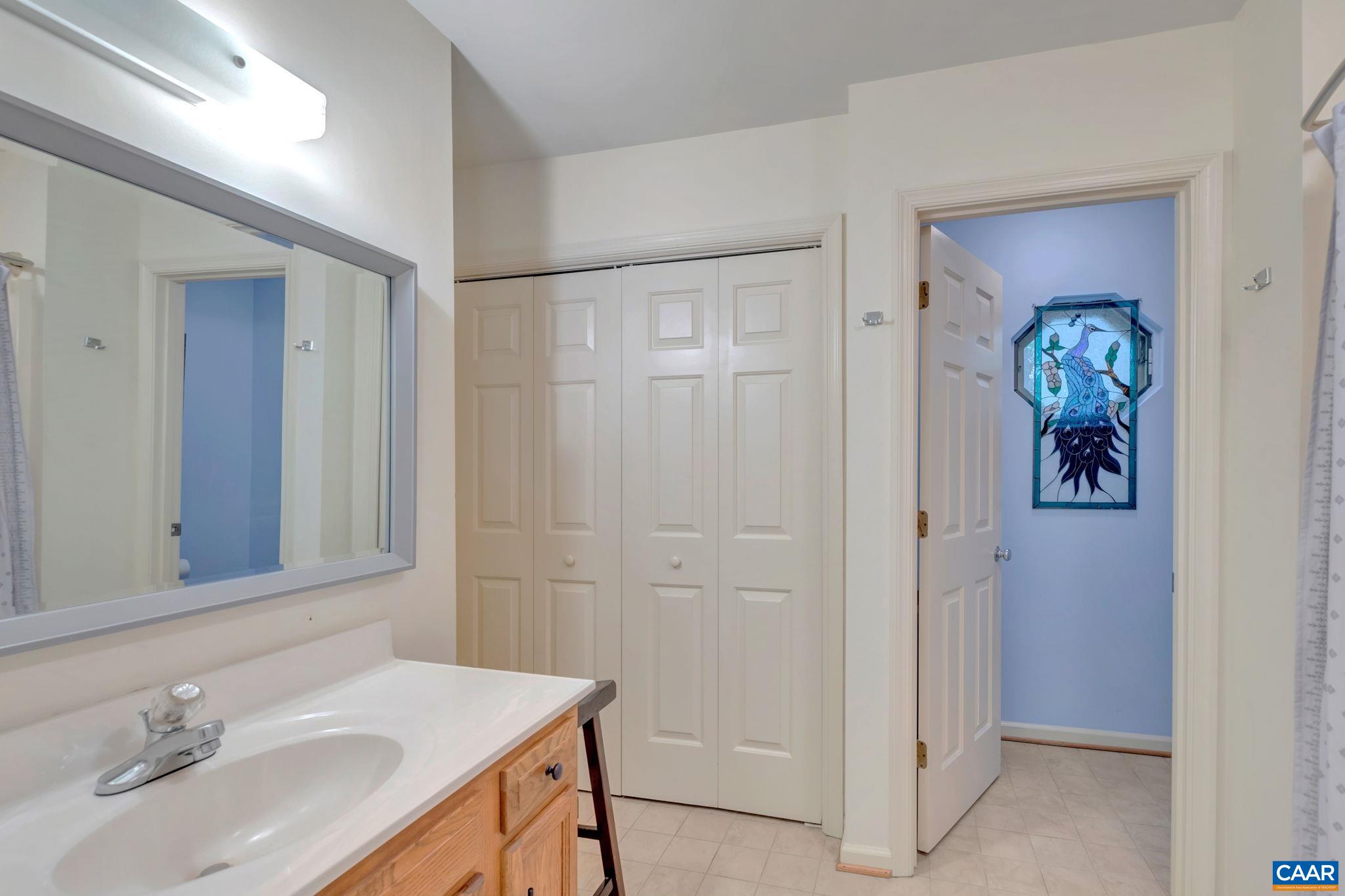 17 Ridgeview Circle Charlottesville, VA 22902 - Photo 11 of 20 a bathroom with a sink and a mirror