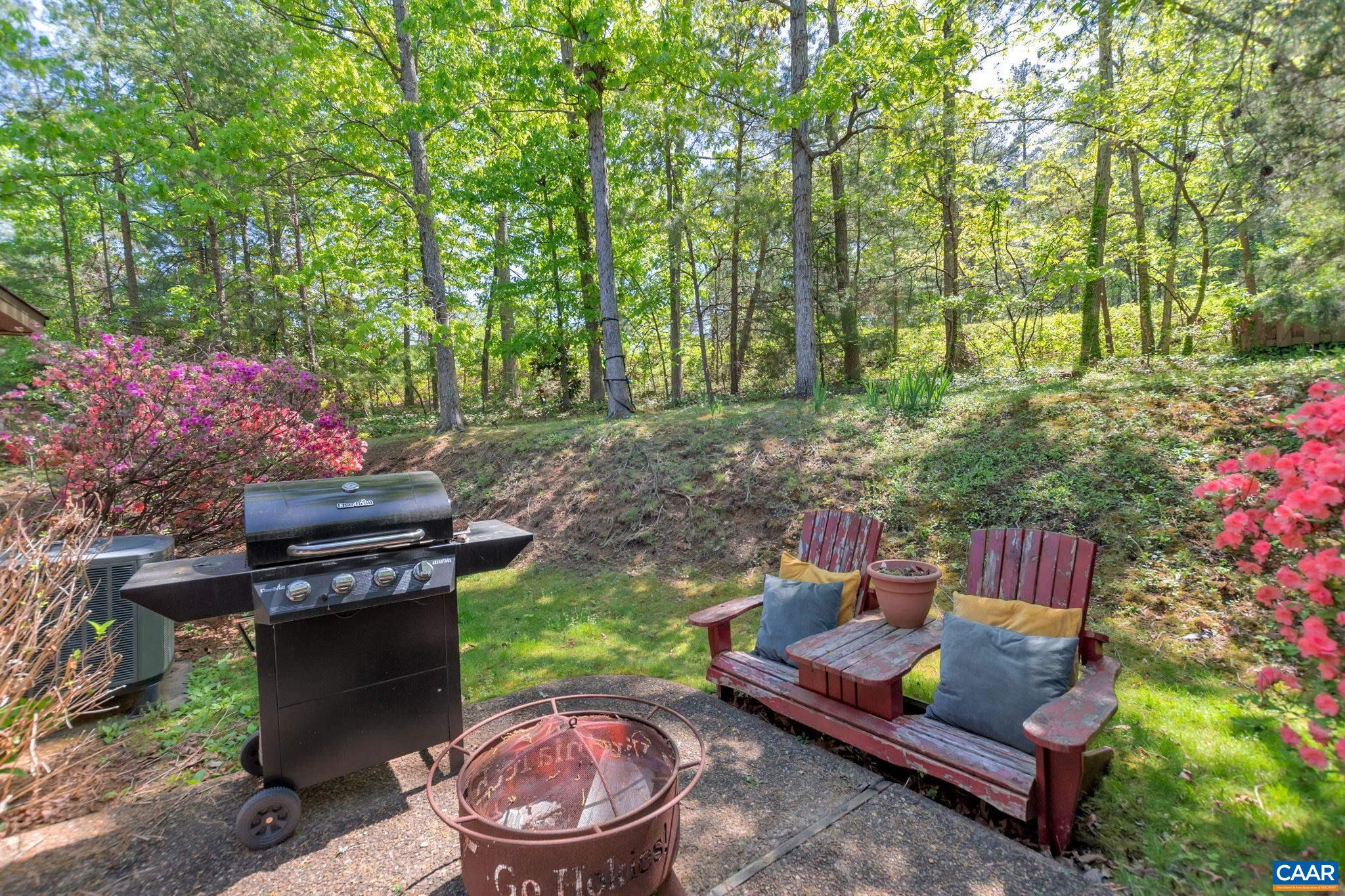 17 Ridgeview Circle Charlottesville, VA 22902 - Photo 17 of 20 a wooden bench sitting in the middle of a forest