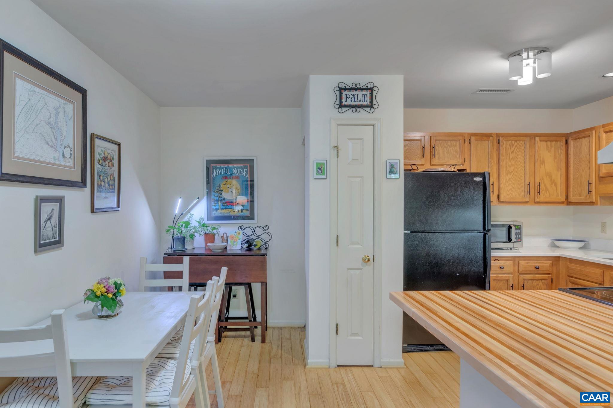17 Ridgeview Circle Charlottesville, VA 22902 - Photo 7 of 20 a kitchen that has a refrigerator and a table in it