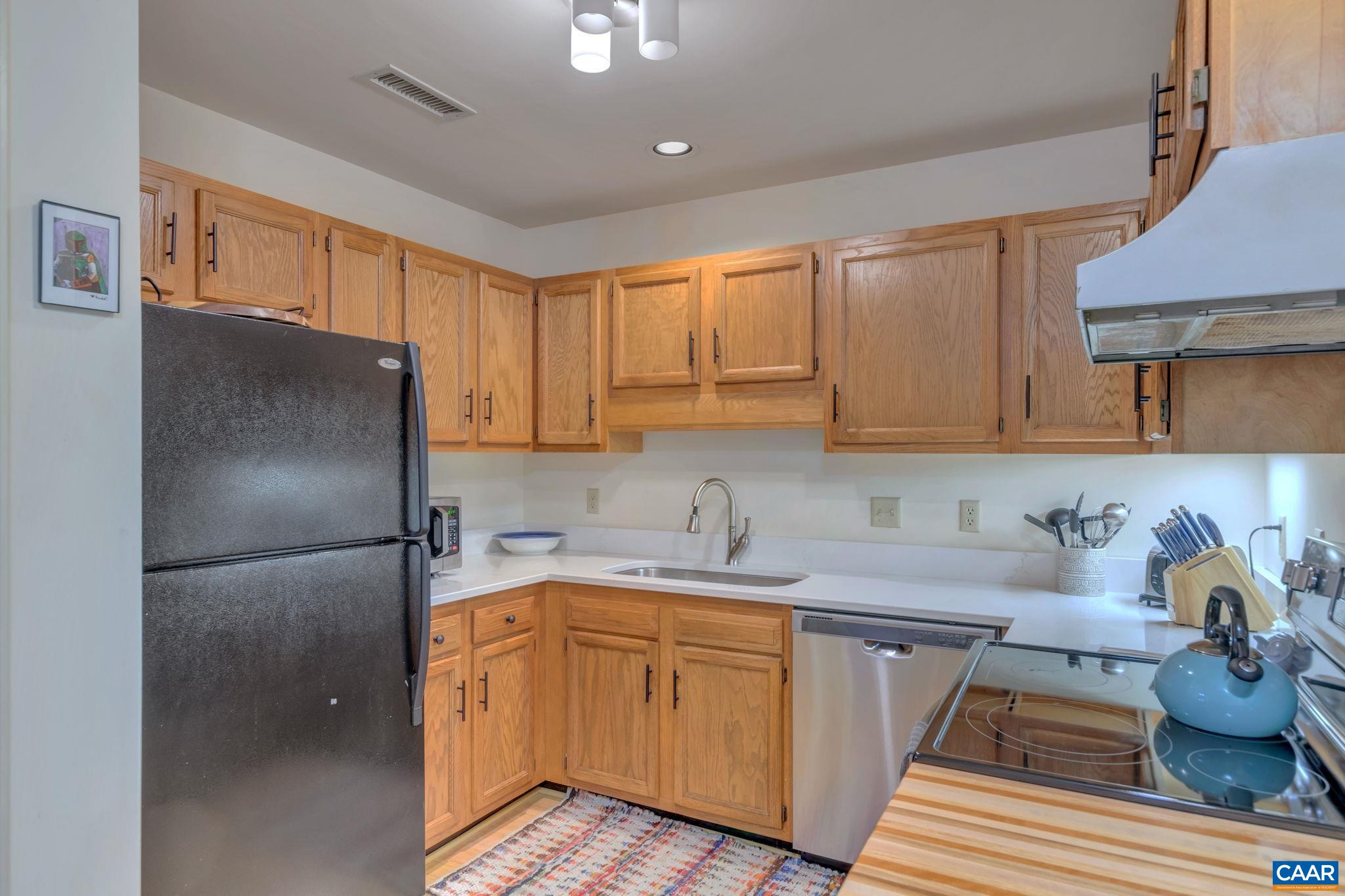 17 Ridgeview Circle Charlottesville, VA 22902 - Photo 8 of 20 a kitchen with a sink refrigerator and cabinets