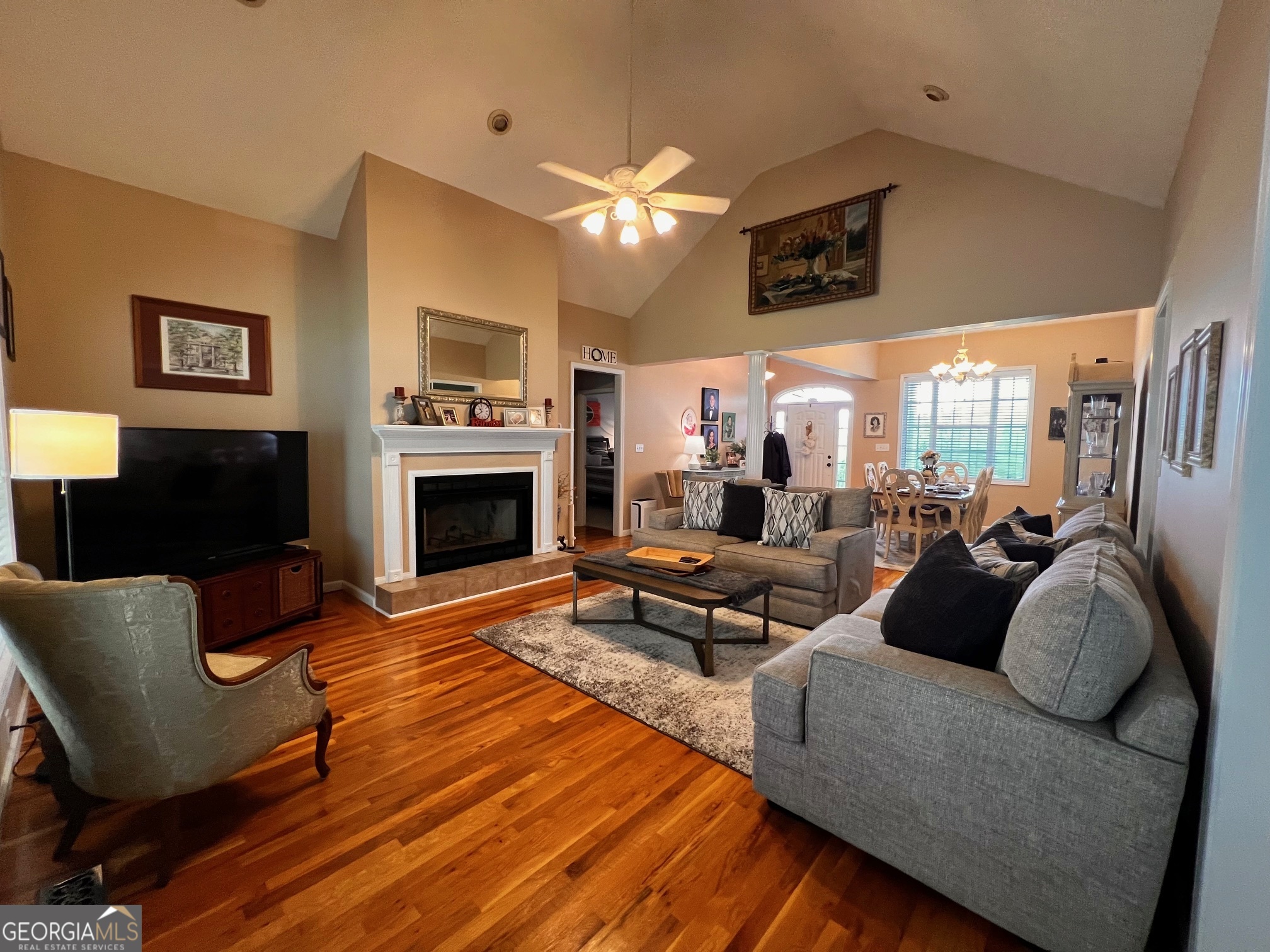 410 Irvin Road Thomaston, GA 30286 - Photo 12 of 42 a living room with furniture a flat screen tv and a fireplace