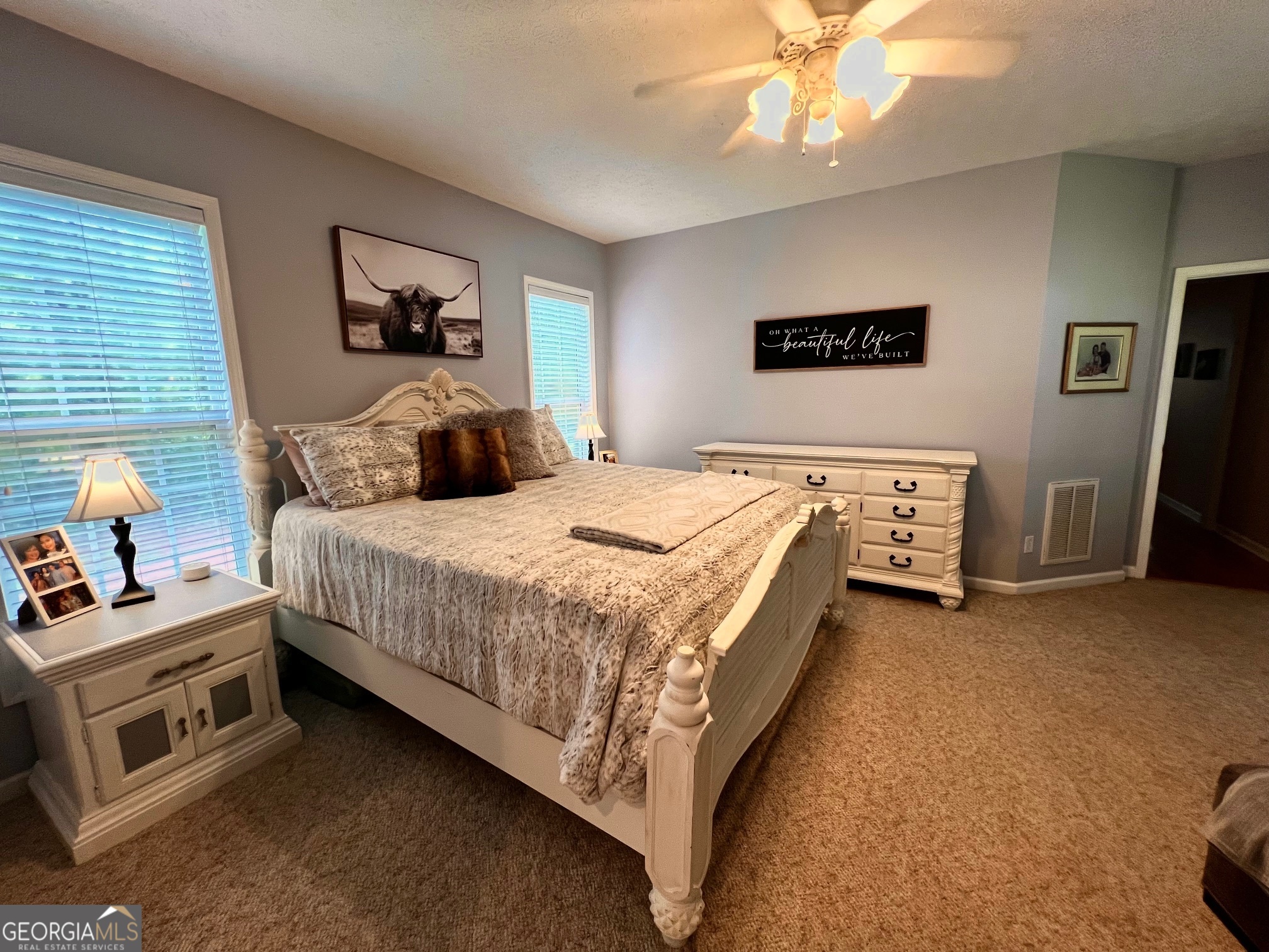 410 Irvin Road Thomaston, GA 30286 - Photo 19 of 42 a bedroom with bed and a chandelier