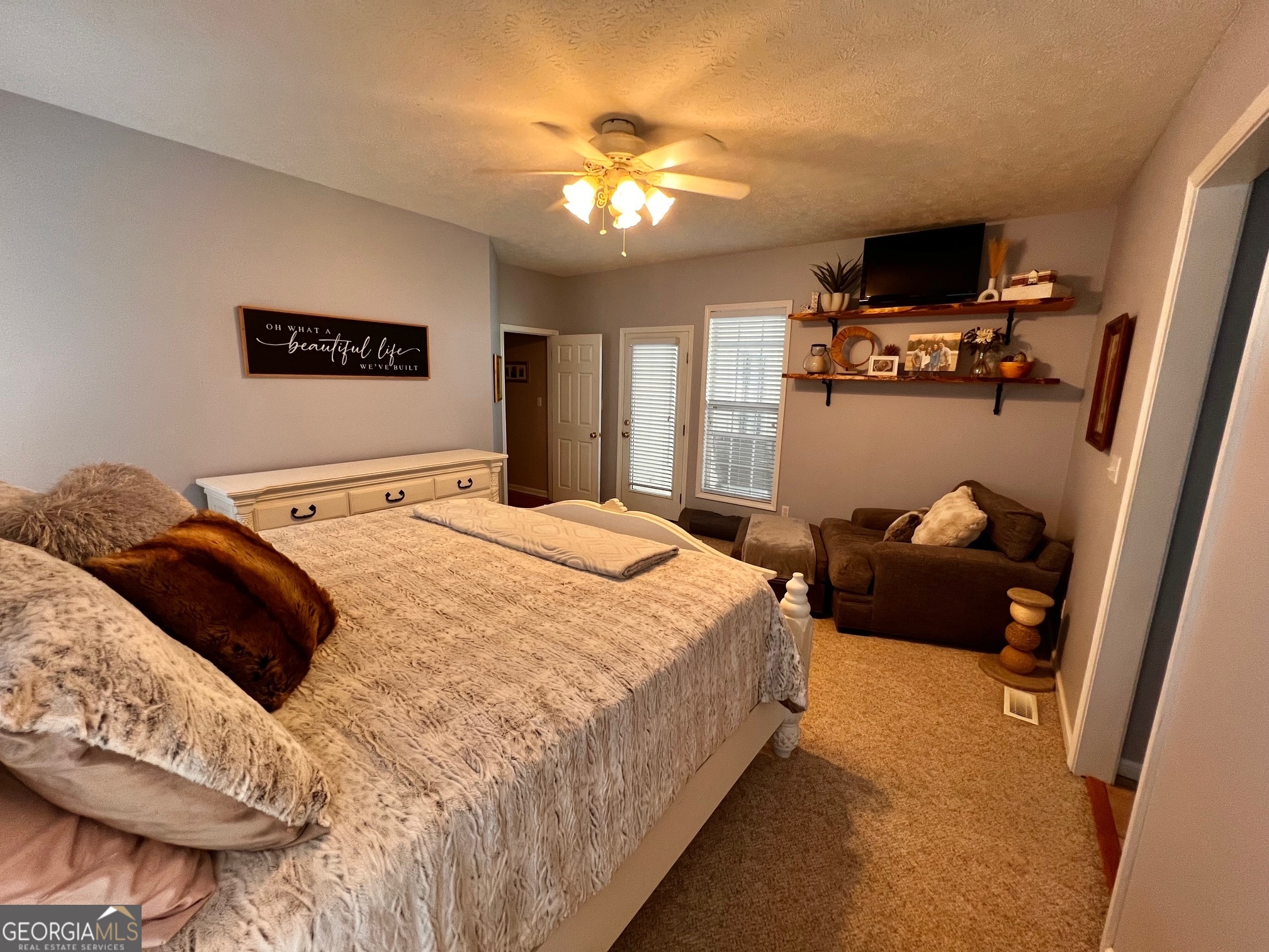 410 Irvin Road Thomaston, GA 30286 - Photo 20 of 42 a bedroom with a bed and a chandelier