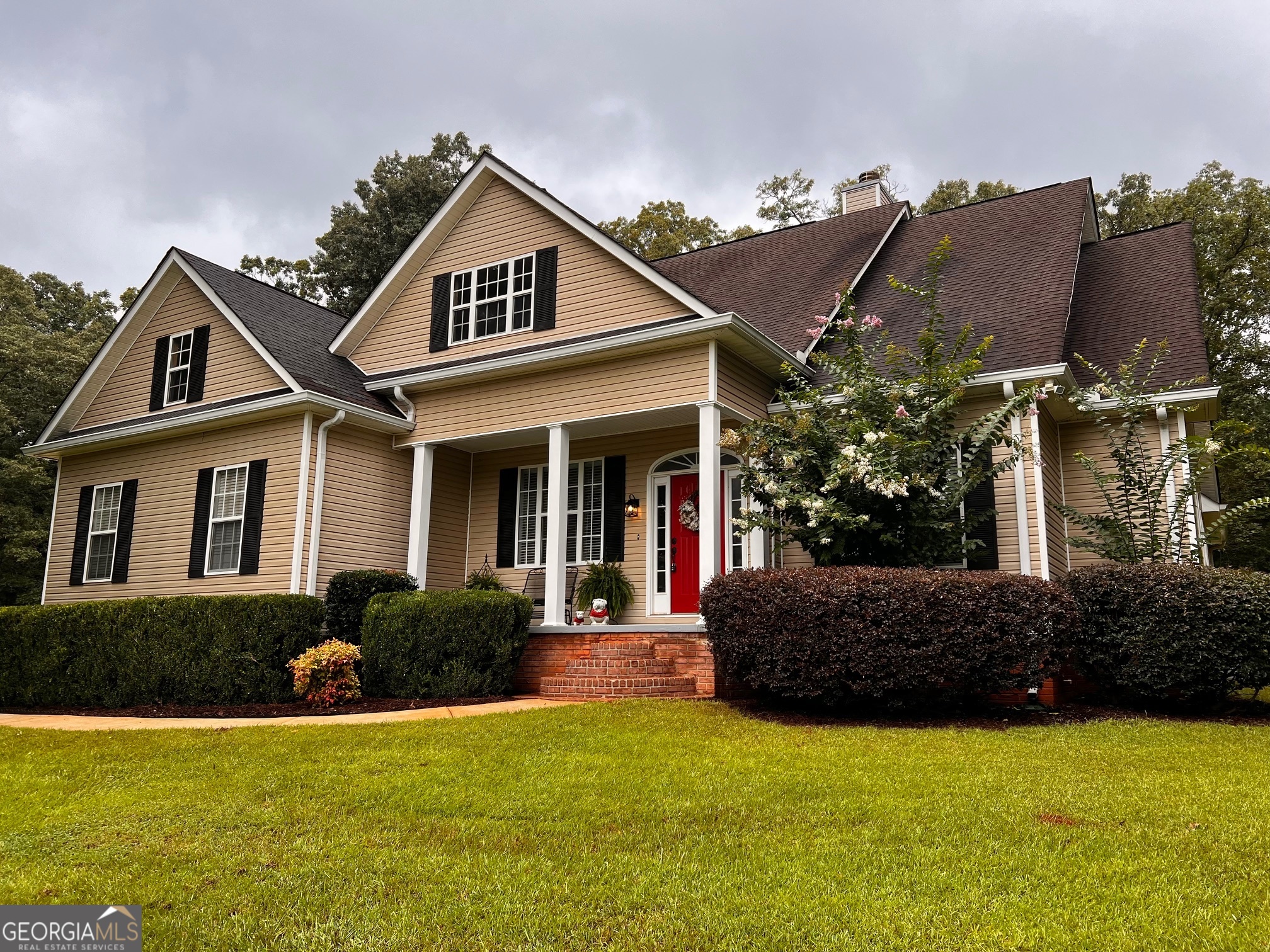410 Irvin Road Thomaston, GA 30286 - Photo 2 of 42 a front view of a house with a yard and garage