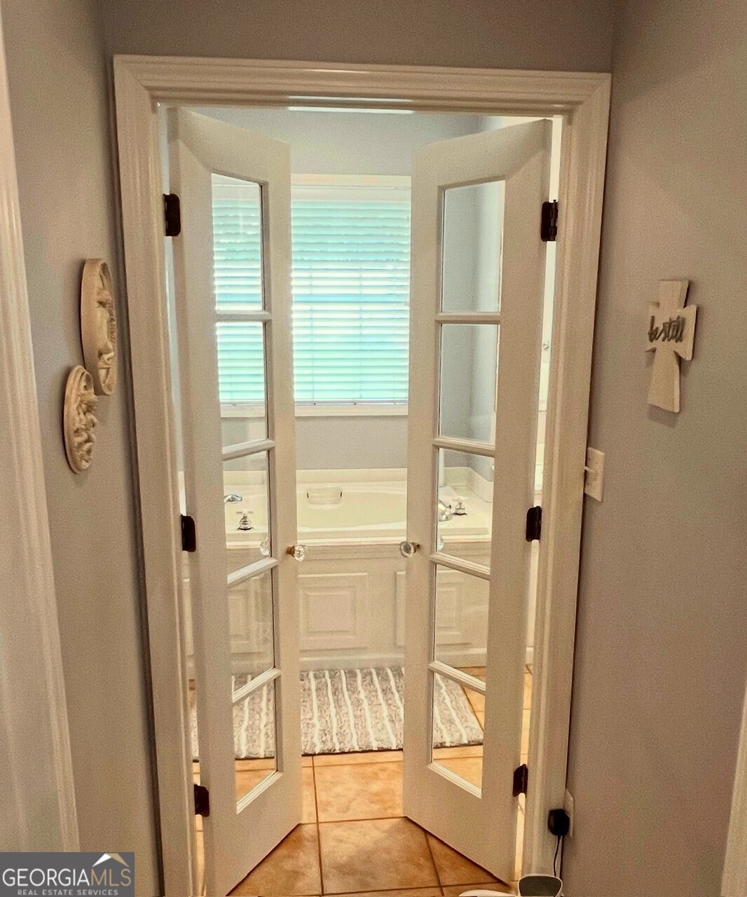 410 Irvin Road Thomaston, GA 30286 - Photo 21 of 42 a view of a bathroom with a glass door and a window