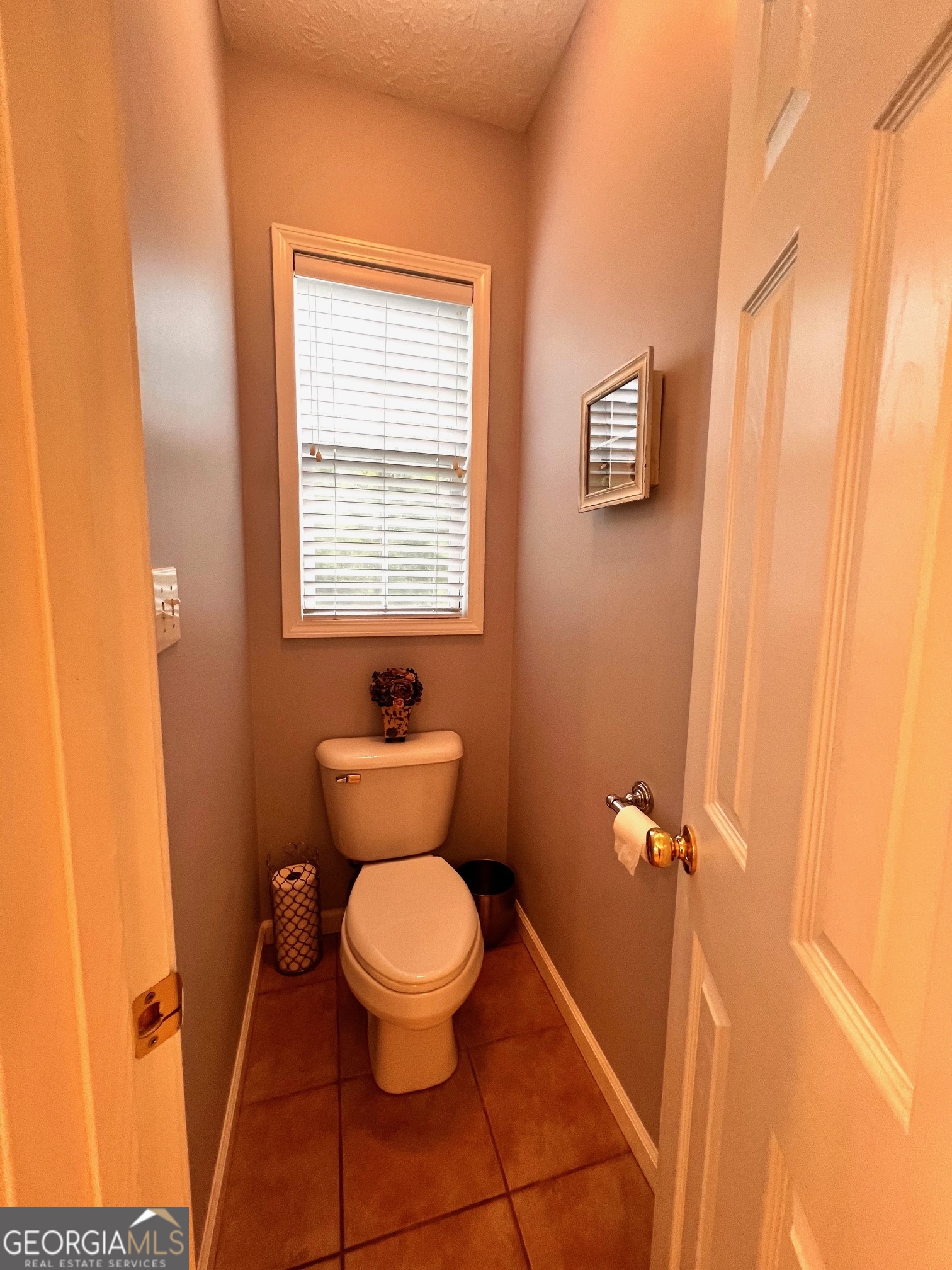 410 Irvin Road Thomaston, GA 30286 - Photo 26 of 42 a bathroom with a toilet a sink and a window