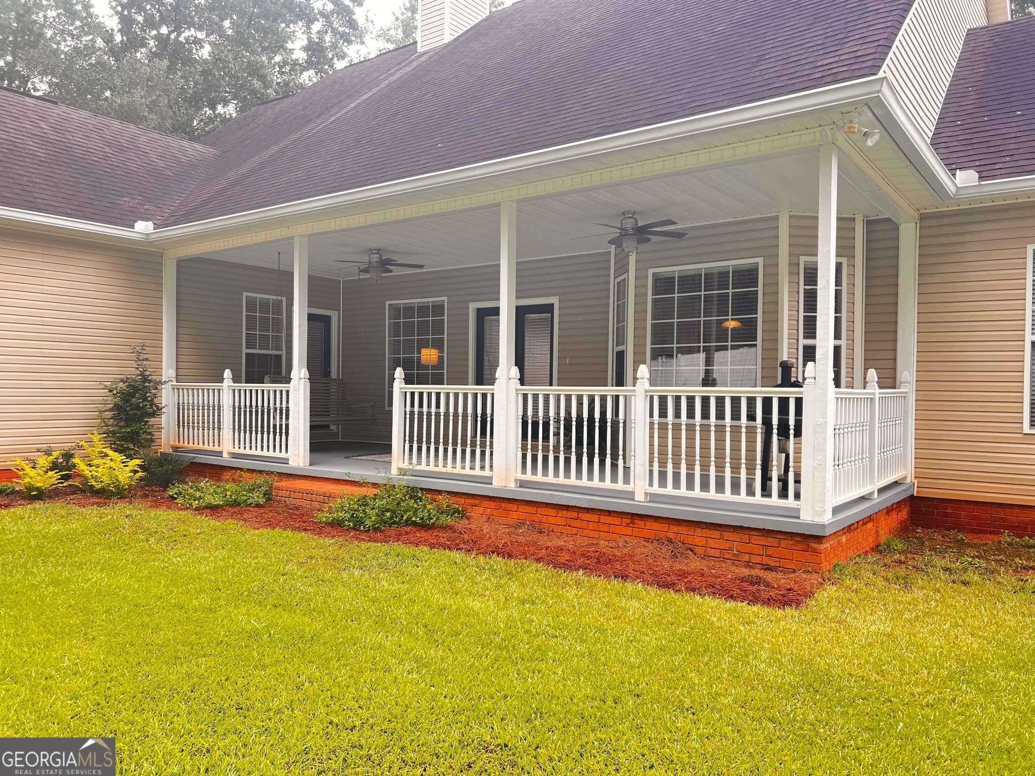 410 Irvin Road Thomaston, GA 30286 - Photo 4 of 42 a front view of a house with a swimming pool