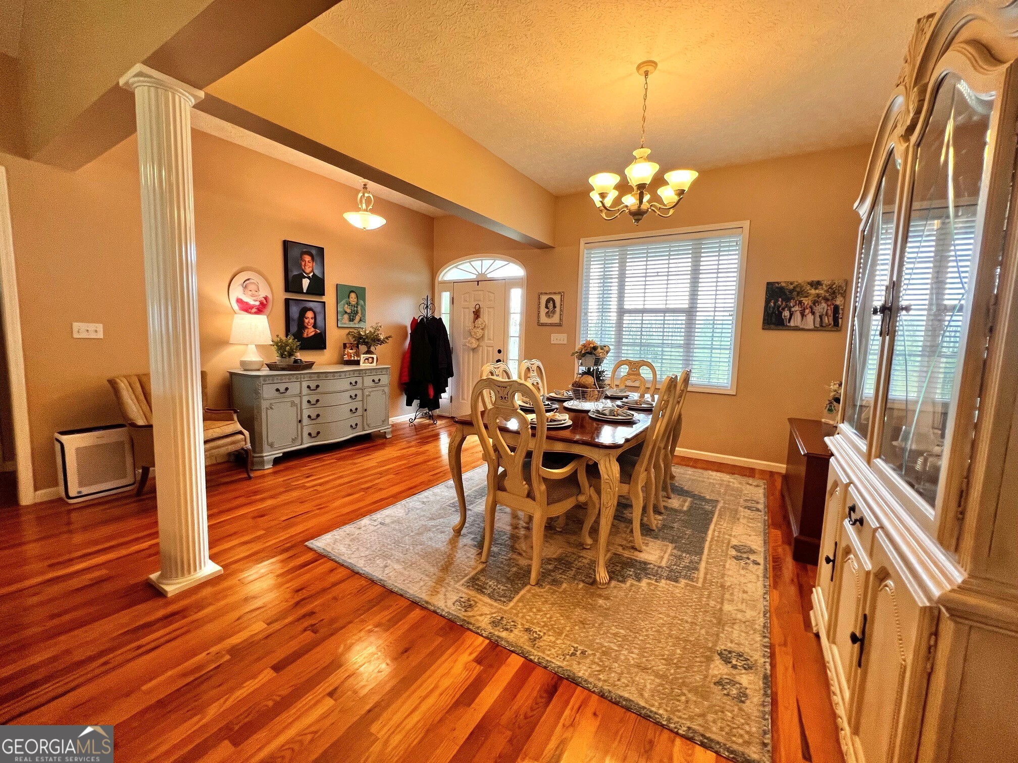 410 Irvin Road Thomaston, GA 30286 - Photo 8 of 42 a view of a dining room with furniture wooden floor and chandelier