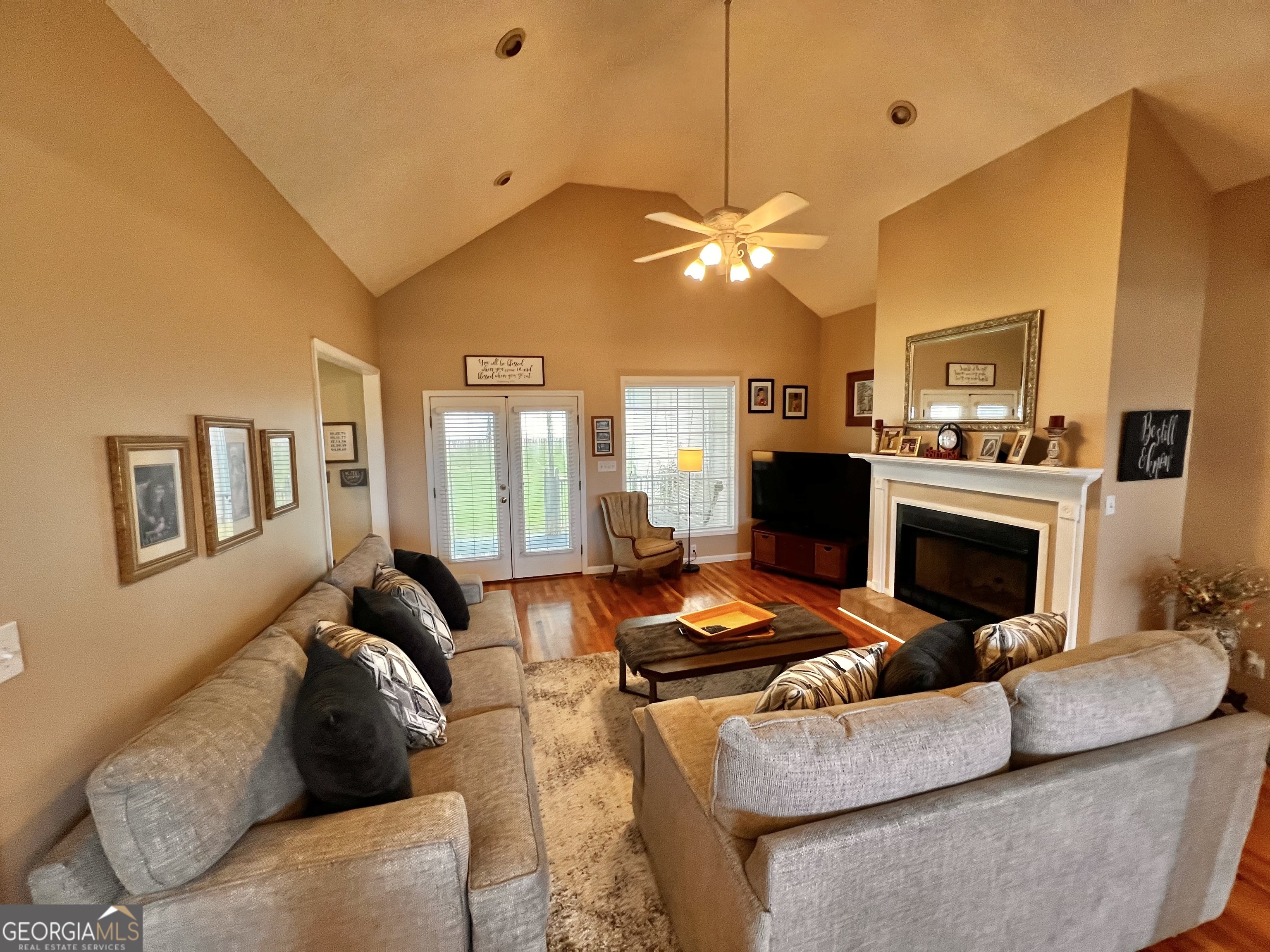 410 Irvin Road Thomaston, GA 30286 - Photo 10 of 42 a living room with furniture a fireplace and a chandelier
