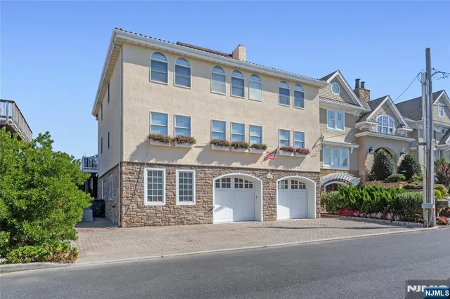 front view of a house with a garden