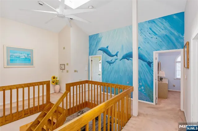 a view of a hallway view with staircase