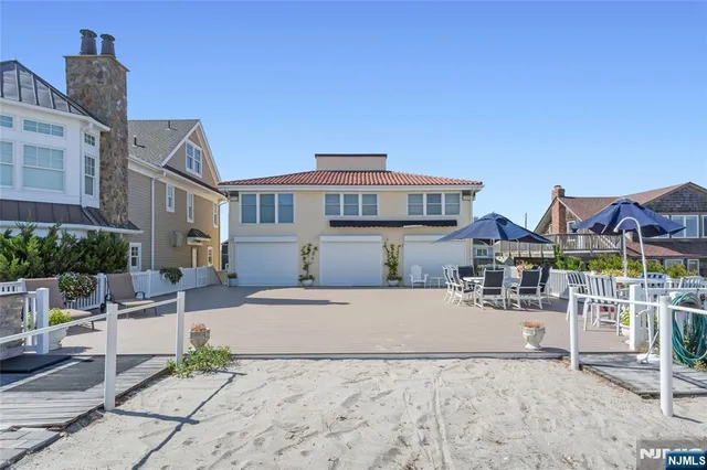 a view of a white building with many windows