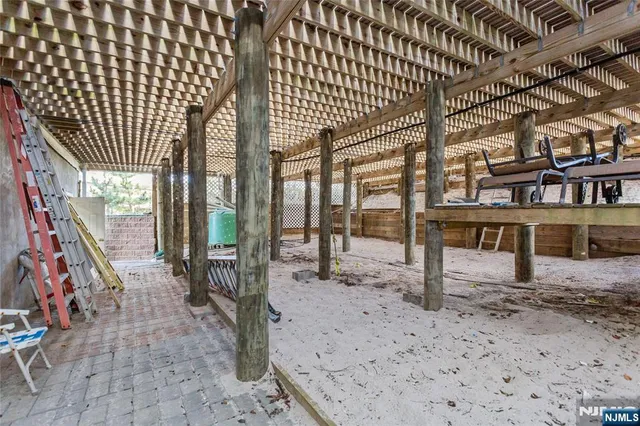 a view of a hall with wooden floor