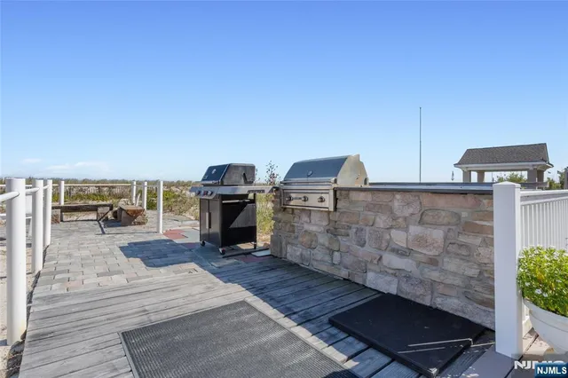 a view of a balcony with furniture