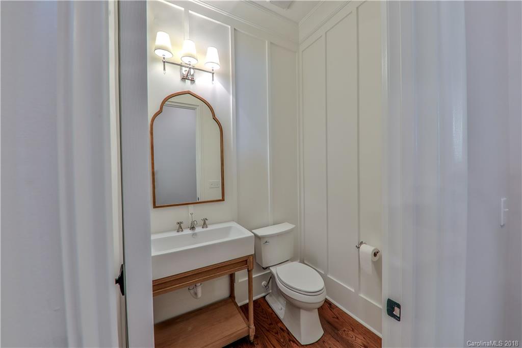724 Ellsworth Road Charlotte, NC 28211 - Photo 13 of 33 a bathroom with a sink a toilet and a mirror