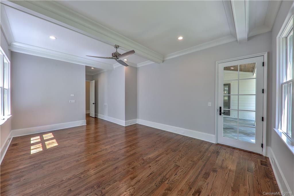 724 Ellsworth Road Charlotte, NC 28211 - Photo 14 of 33 wooden floor in an empty room with a window