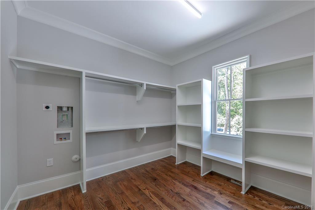 724 Ellsworth Road Charlotte, NC 28211 - Photo 17 of 33 a view of room with wooden floor and cabinet
