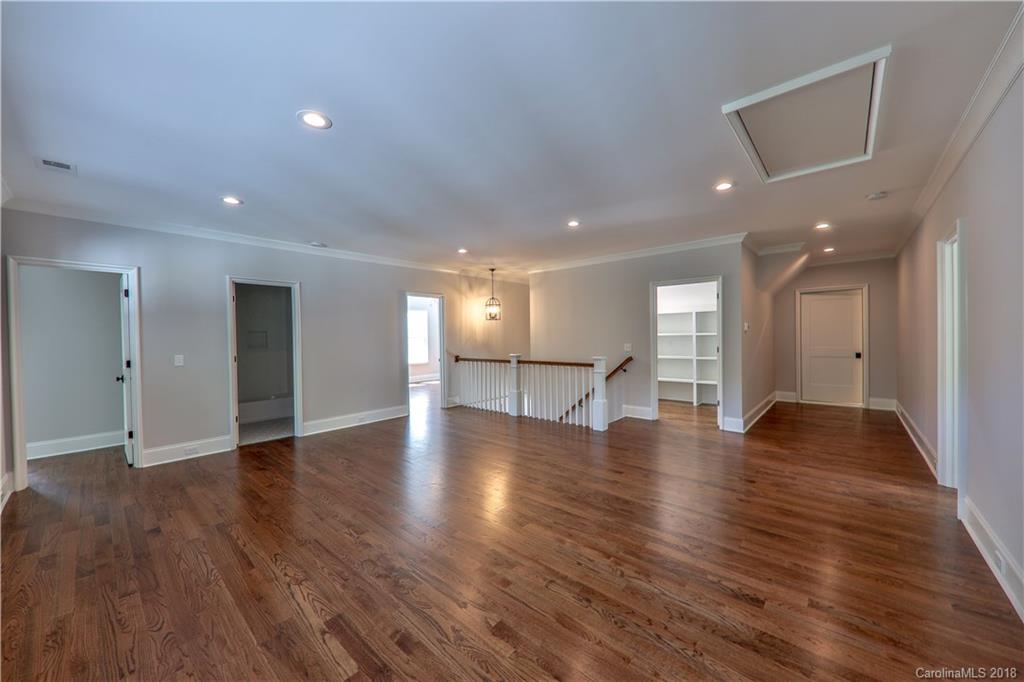 724 Ellsworth Road Charlotte, NC 28211 - Photo 19 of 33 a view of an empty room with wooden floor