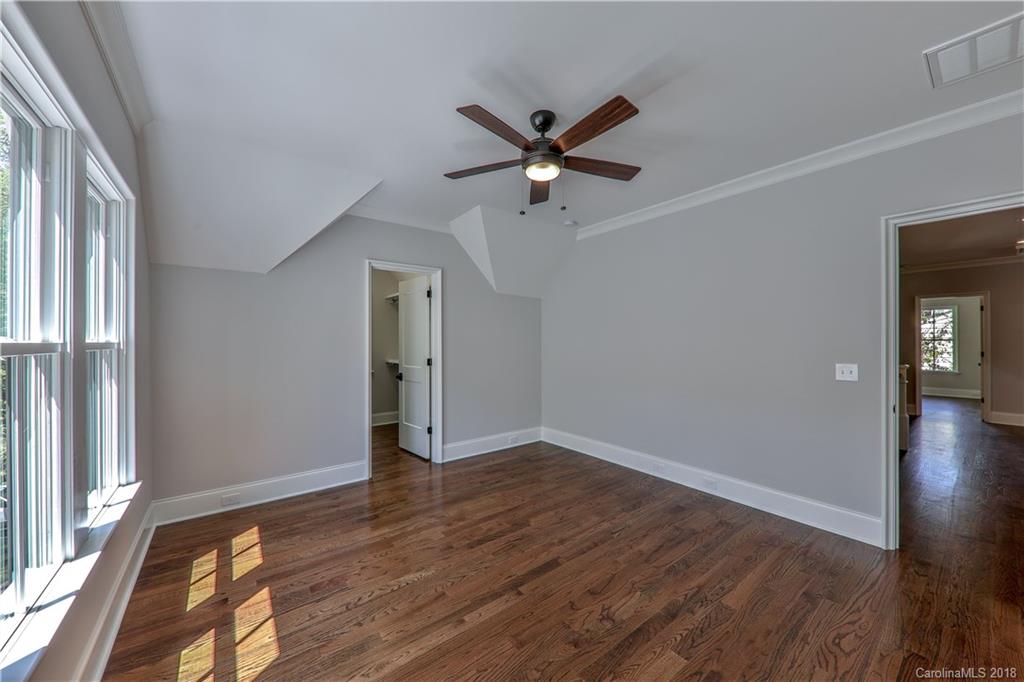 724 Ellsworth Road Charlotte, NC 28211 - Photo 21 of 33 wooden floor in an empty room with a window