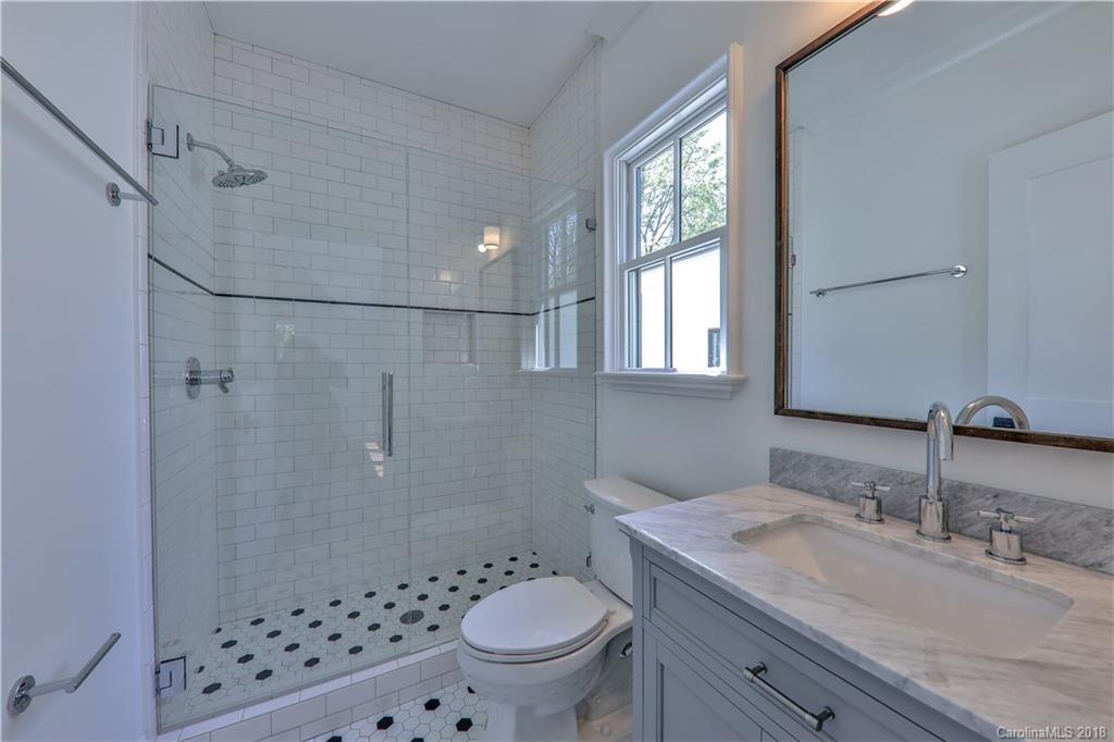 724 Ellsworth Road Charlotte, NC 28211 - Photo 22 of 33 a bathroom with a sink toilet and shower