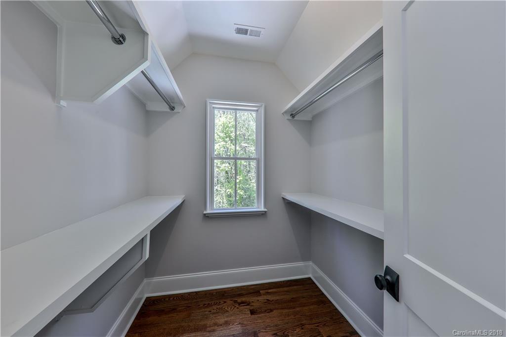 724 Ellsworth Road Charlotte, NC 28211 - Photo 23 of 33 a room that has a window and wooden floor