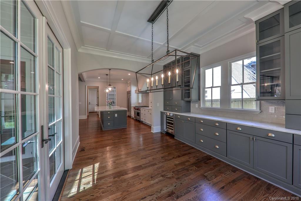 724 Ellsworth Road Charlotte, NC 28211 - Photo 7 of 33 a kitchen with counter top space and wooden floor