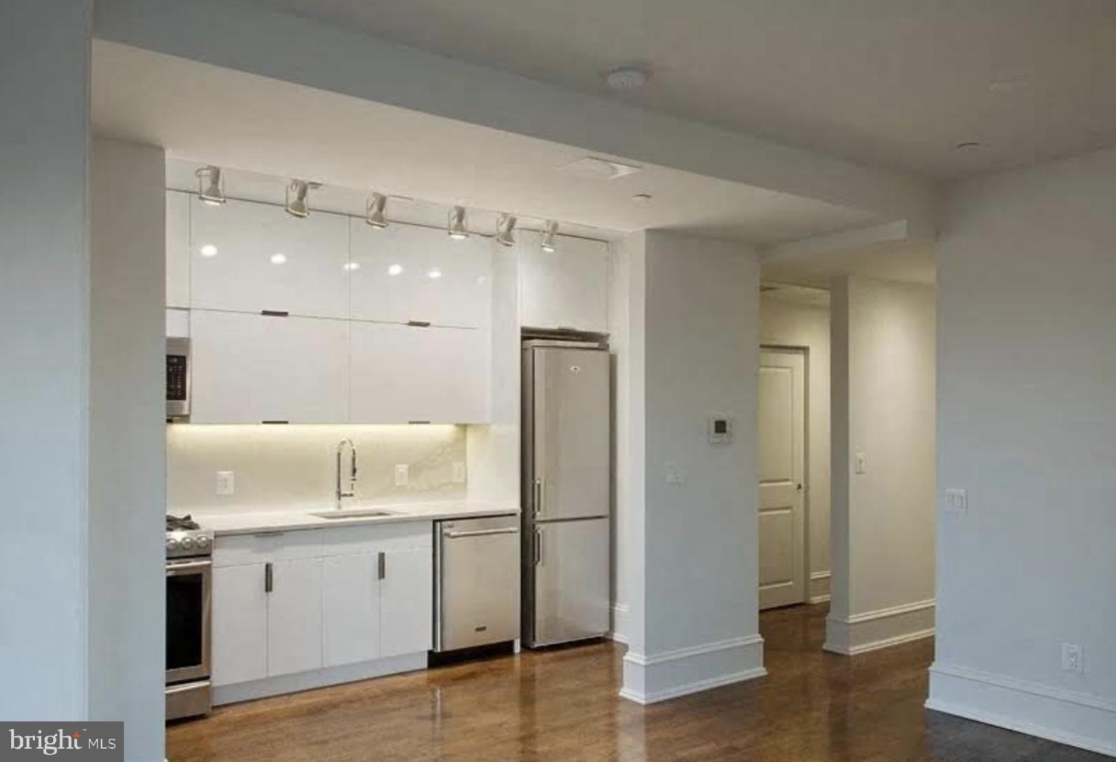 501 Seward Square Southeast, Unit 5 Washington, DC 20003 - Photo 3 of 4 a bathroom with a shower sink and mirror