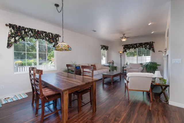 a view of a dining room with furniture window and wooden floor