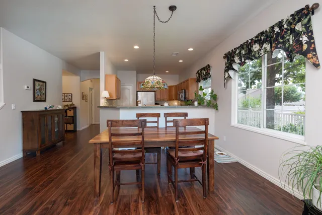 a living room with furniture a table and a fireplace
