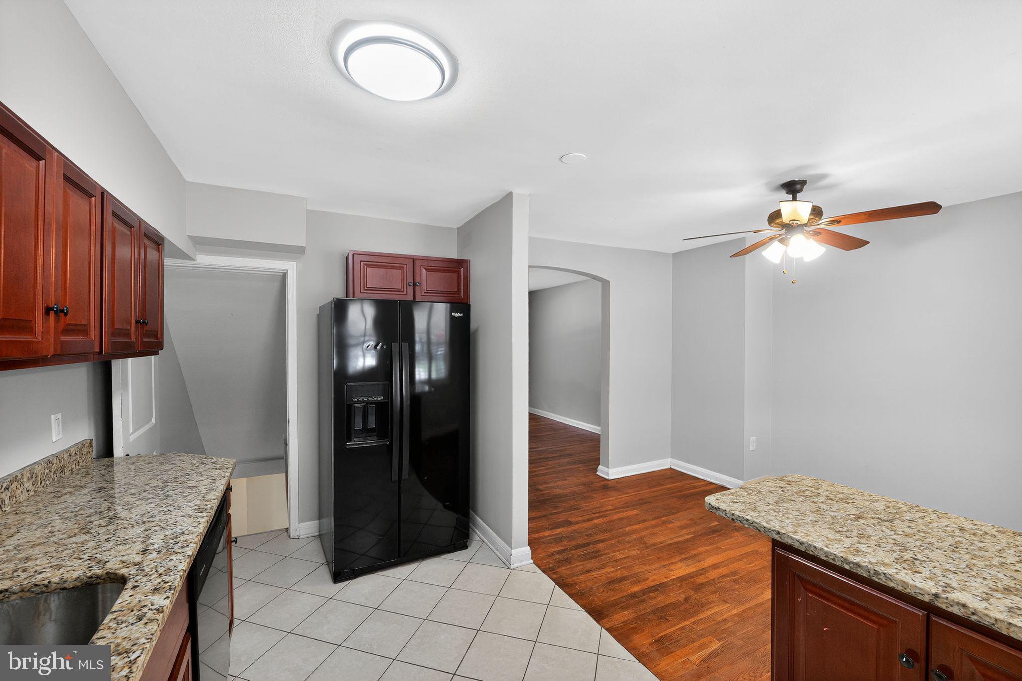 3125 Vulcan Road Dundalk, MD 21222 - Photo 20 of 33 a kitchen with granite countertop a refrigerator and a sink