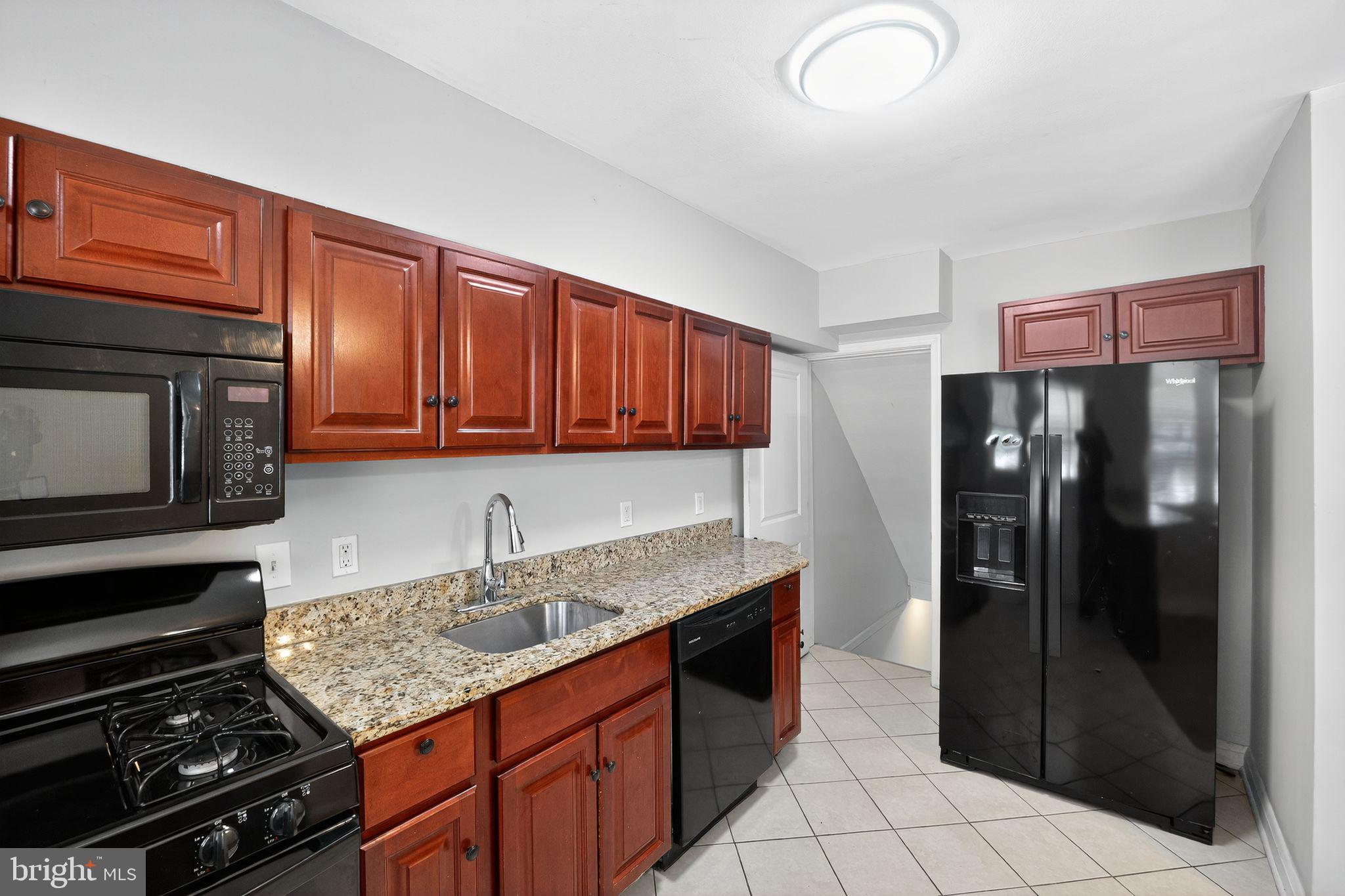 3125 Vulcan Road Dundalk, MD 21222 - Photo 21 of 33 a kitchen with stainless steel appliances granite countertop a refrigerator stove and sink