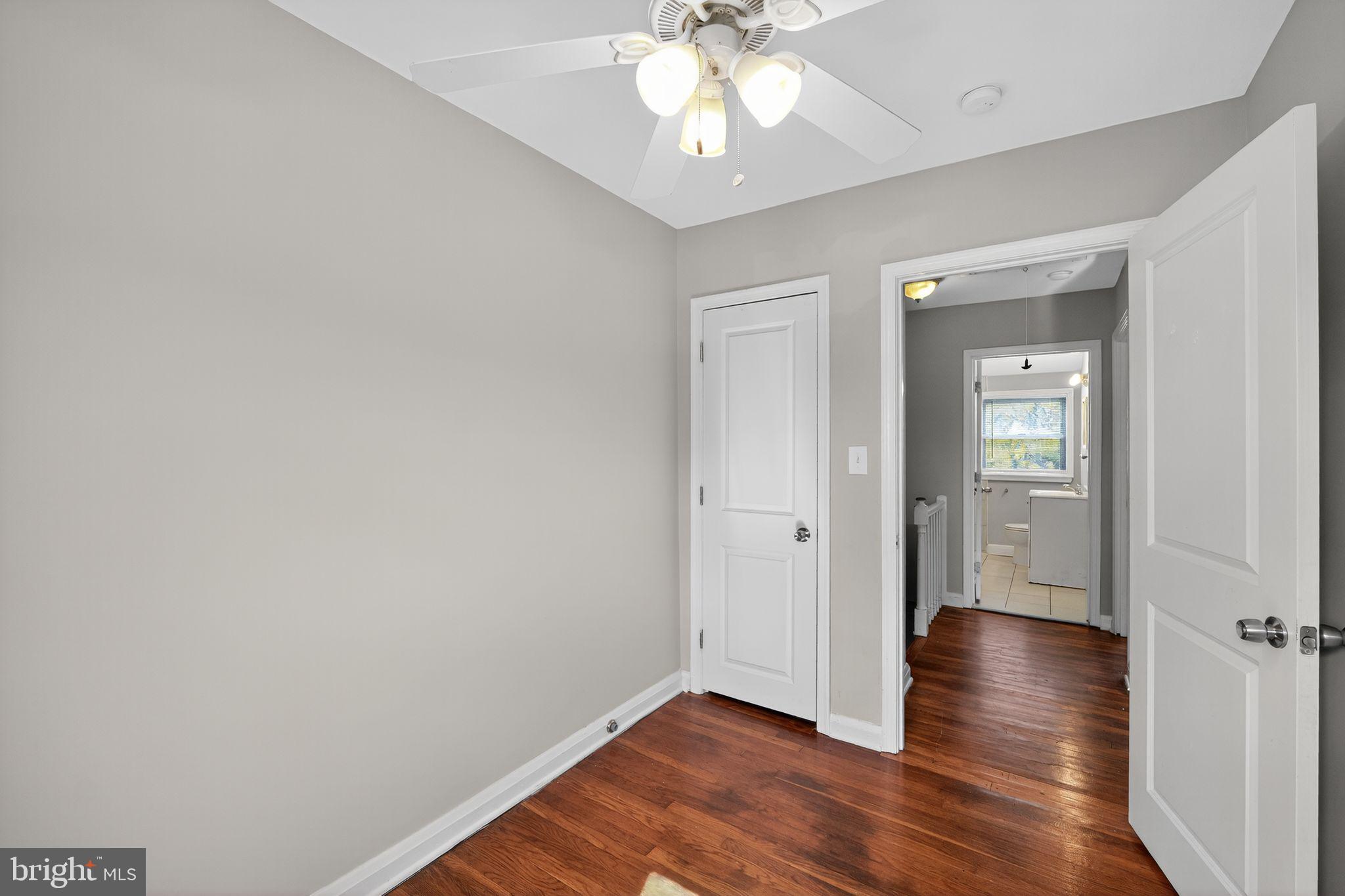 3125 Vulcan Road Dundalk, MD 21222 - Photo 25 of 33 wooden floor in an empty room with a window
