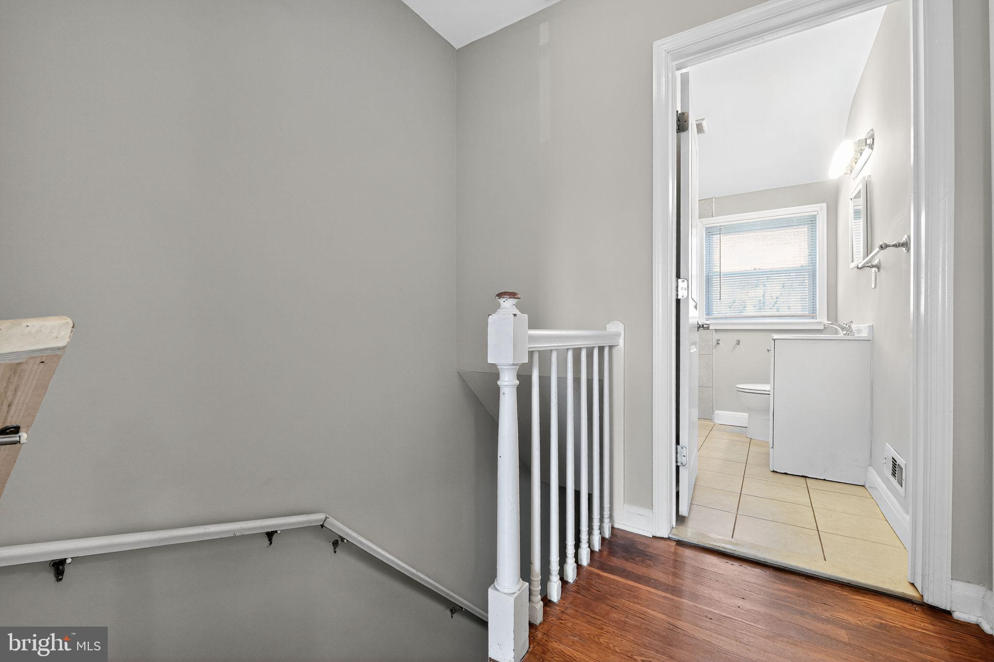 3125 Vulcan Road Dundalk, MD 21222 - Photo 30 of 33 an empty room with wooden floor and entrance