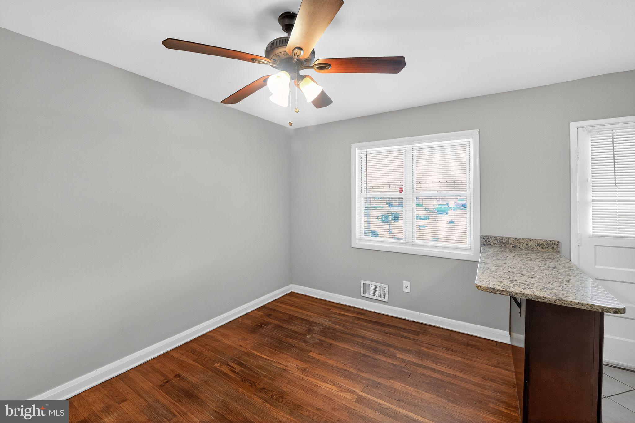 3125 Vulcan Road Dundalk, MD 21222 - Photo 6 of 33 a view of a room with wooden floor and window