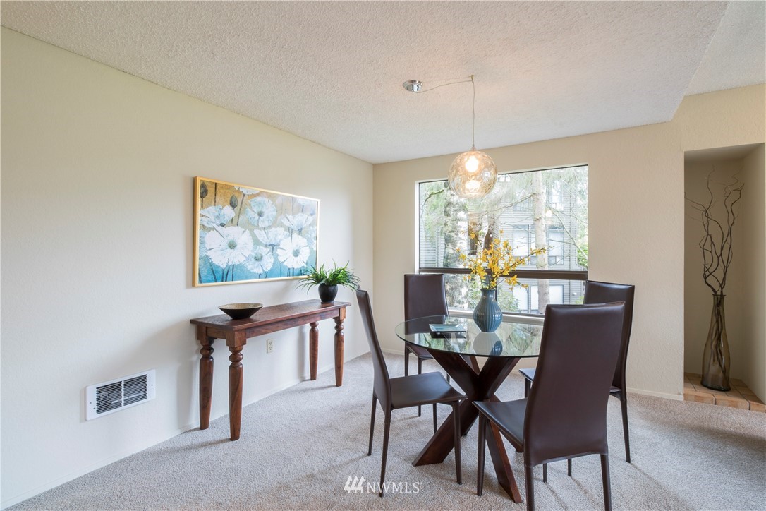 118 Southwest 116th Street, Unit D21 Seattle, WA 98146 - Photo 4 of 17 a view of a dining room with furniture window and outside view