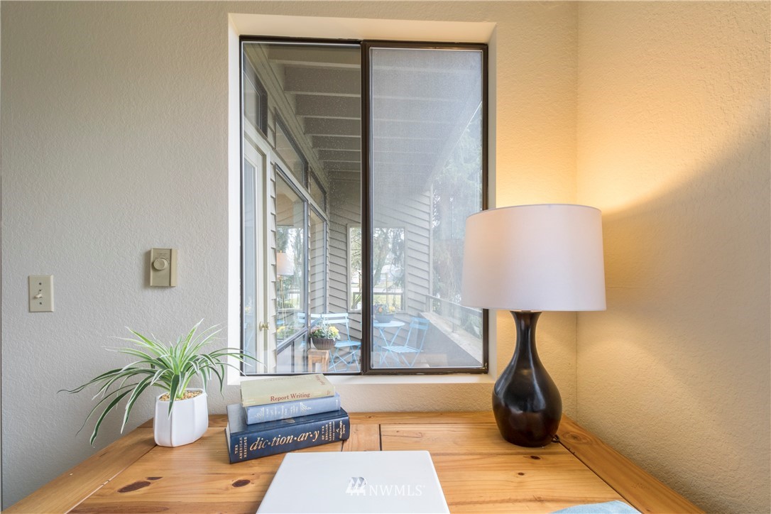 118 Southwest 116th Street, Unit D21 Seattle, WA 98146 - Photo 10 of 17 a potted plant sitting on a table next to a window