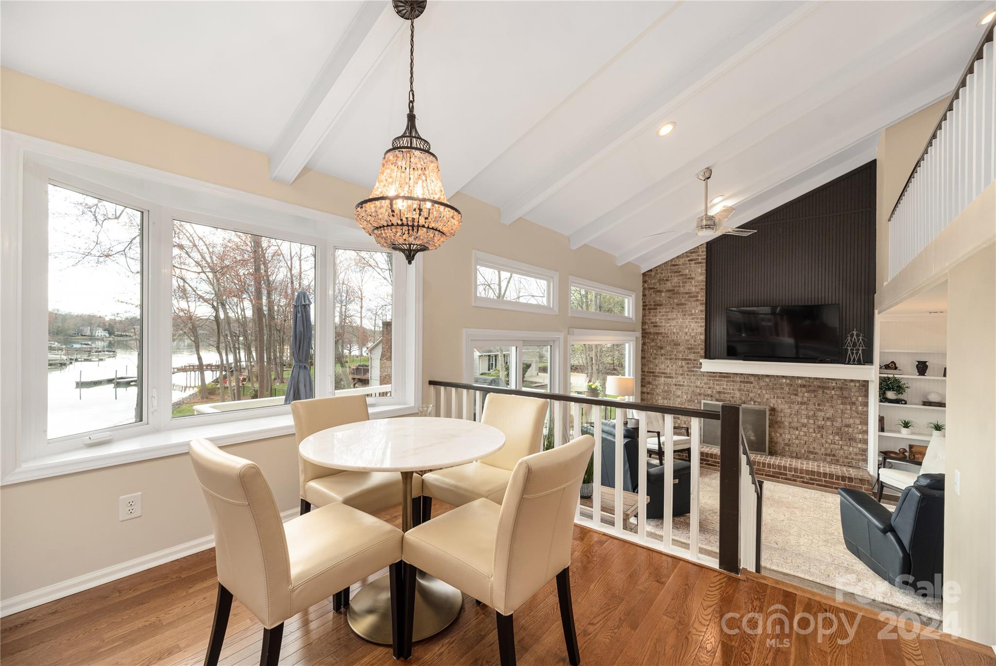 21525 Sandy Cove Road Cornelius, NC 28031 - Photo 13 of 35 a view of a dining room with furniture window and wooden floor