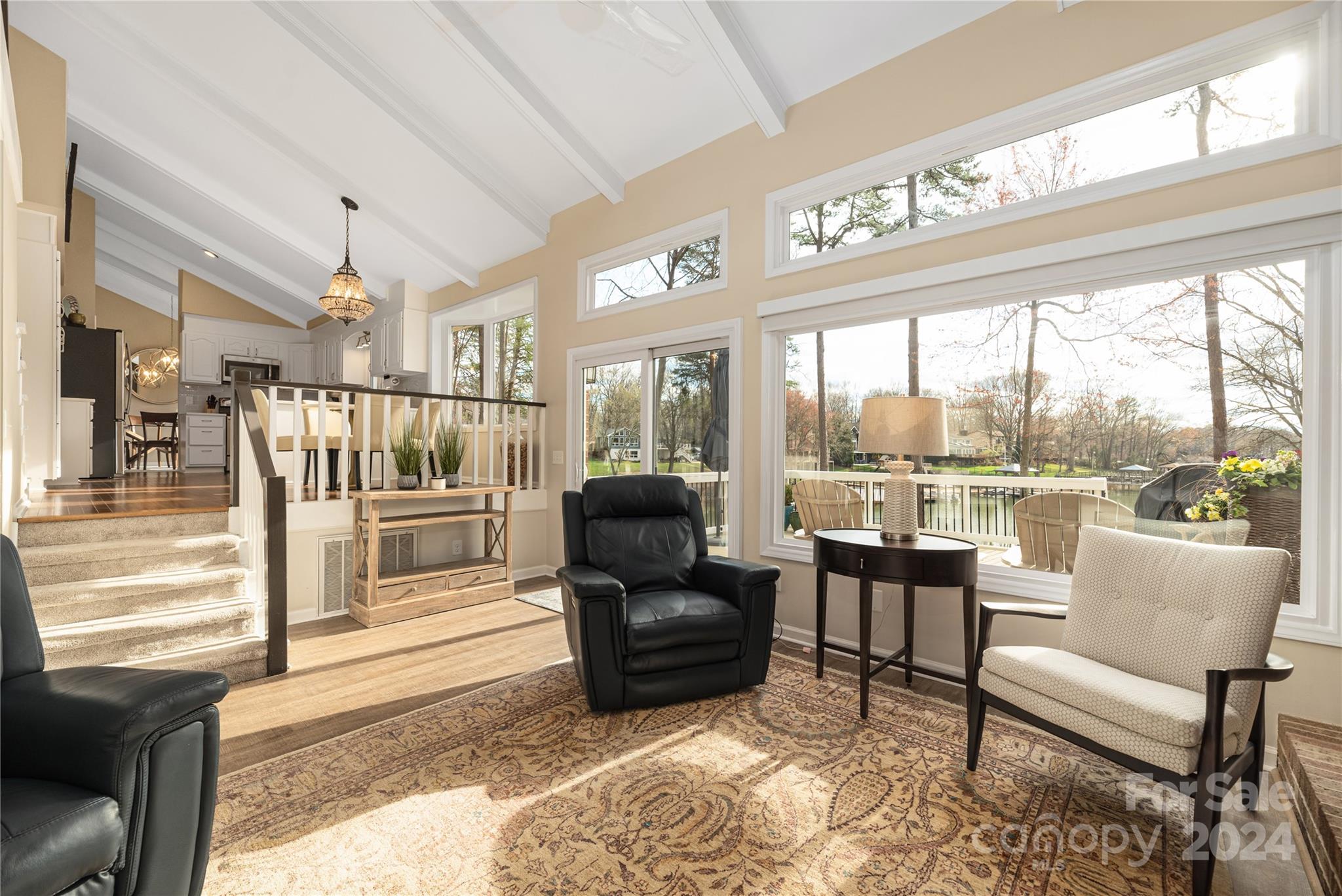 21525 Sandy Cove Road Cornelius, NC 28031 - Photo 15 of 35 a living room with furniture and a large window