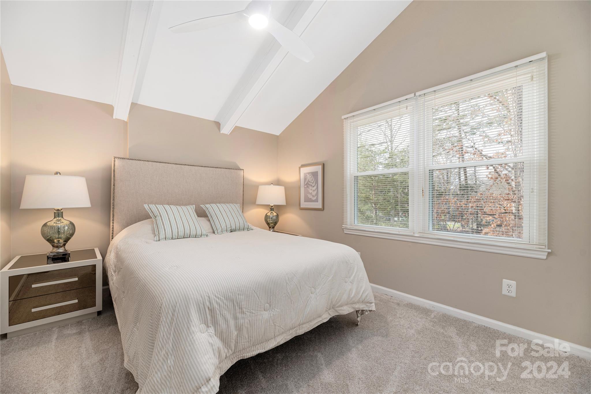 21525 Sandy Cove Road Cornelius, NC 28031 - Photo 20 of 35 a bedroom with a bed and a window