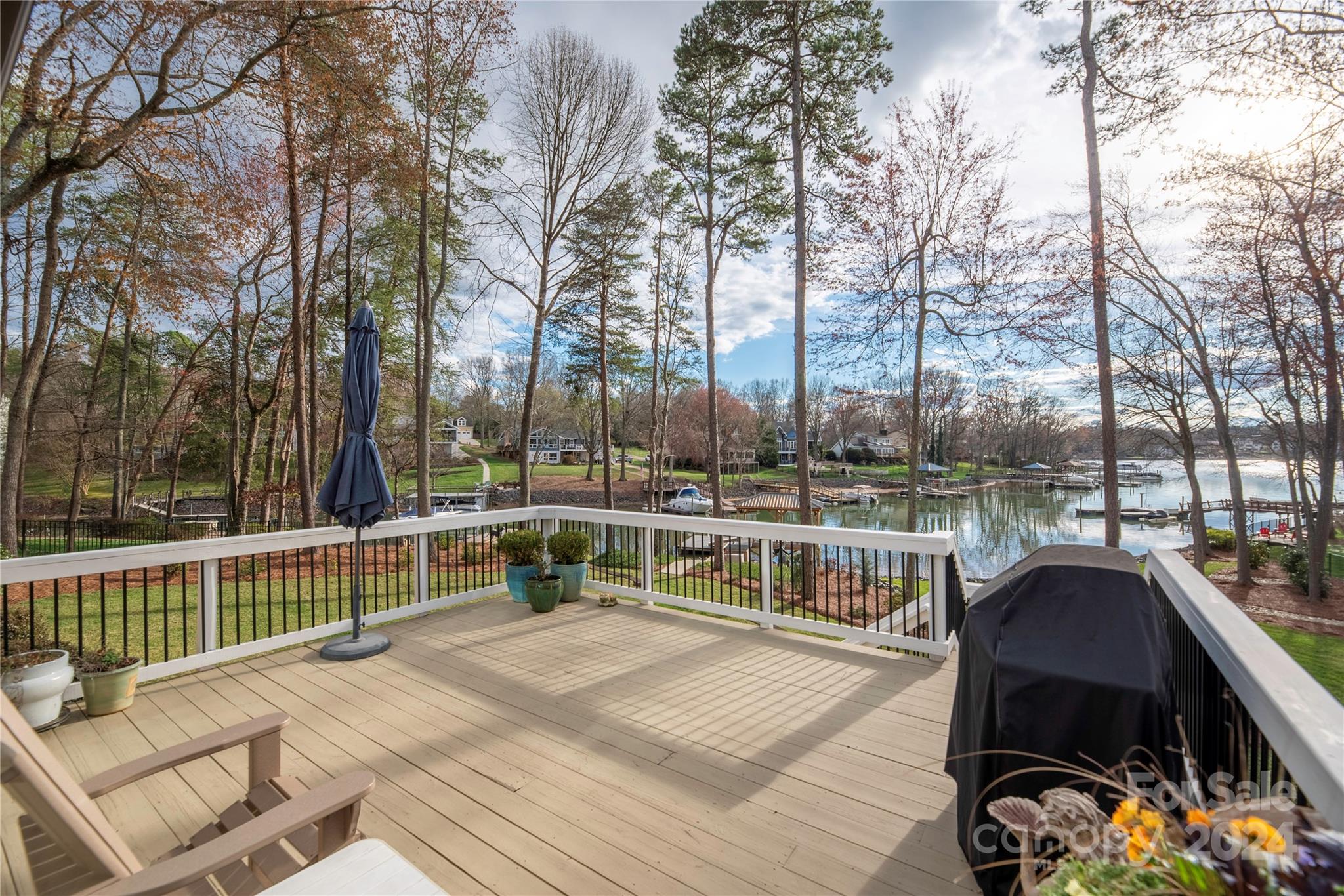 21525 Sandy Cove Road Cornelius, NC 28031 - Photo 24 of 35 a view of balcony with wooden floor and outdoor seating