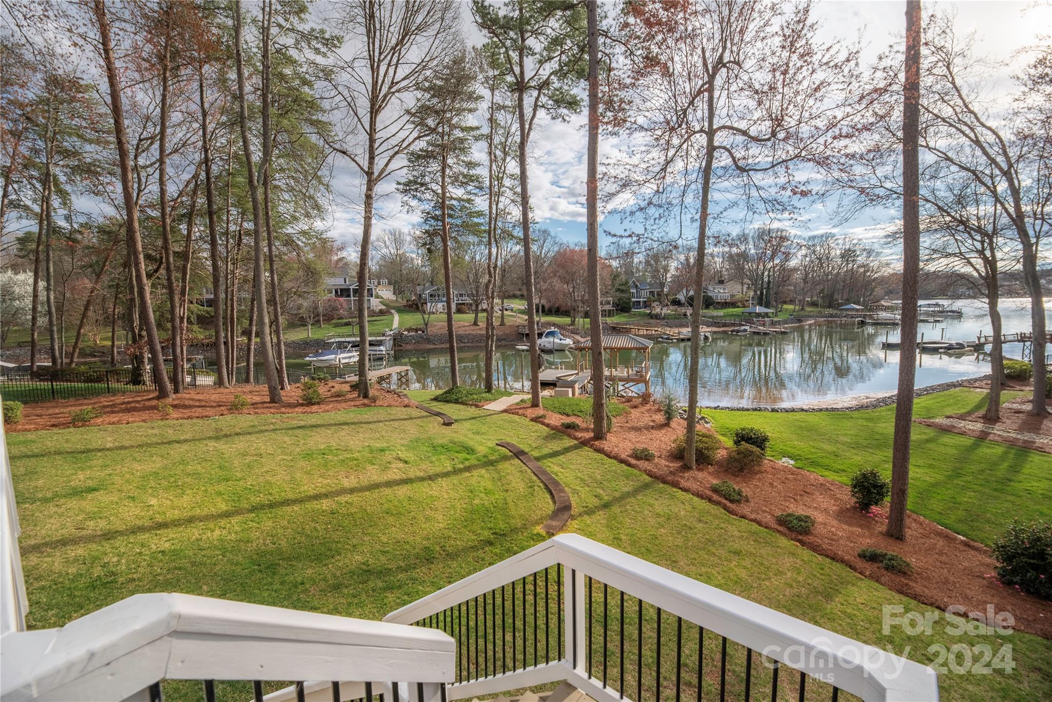 21525 Sandy Cove Road Cornelius, NC 28031 - Photo 25 of 35 a view of a swimming pool with a patio and a yard