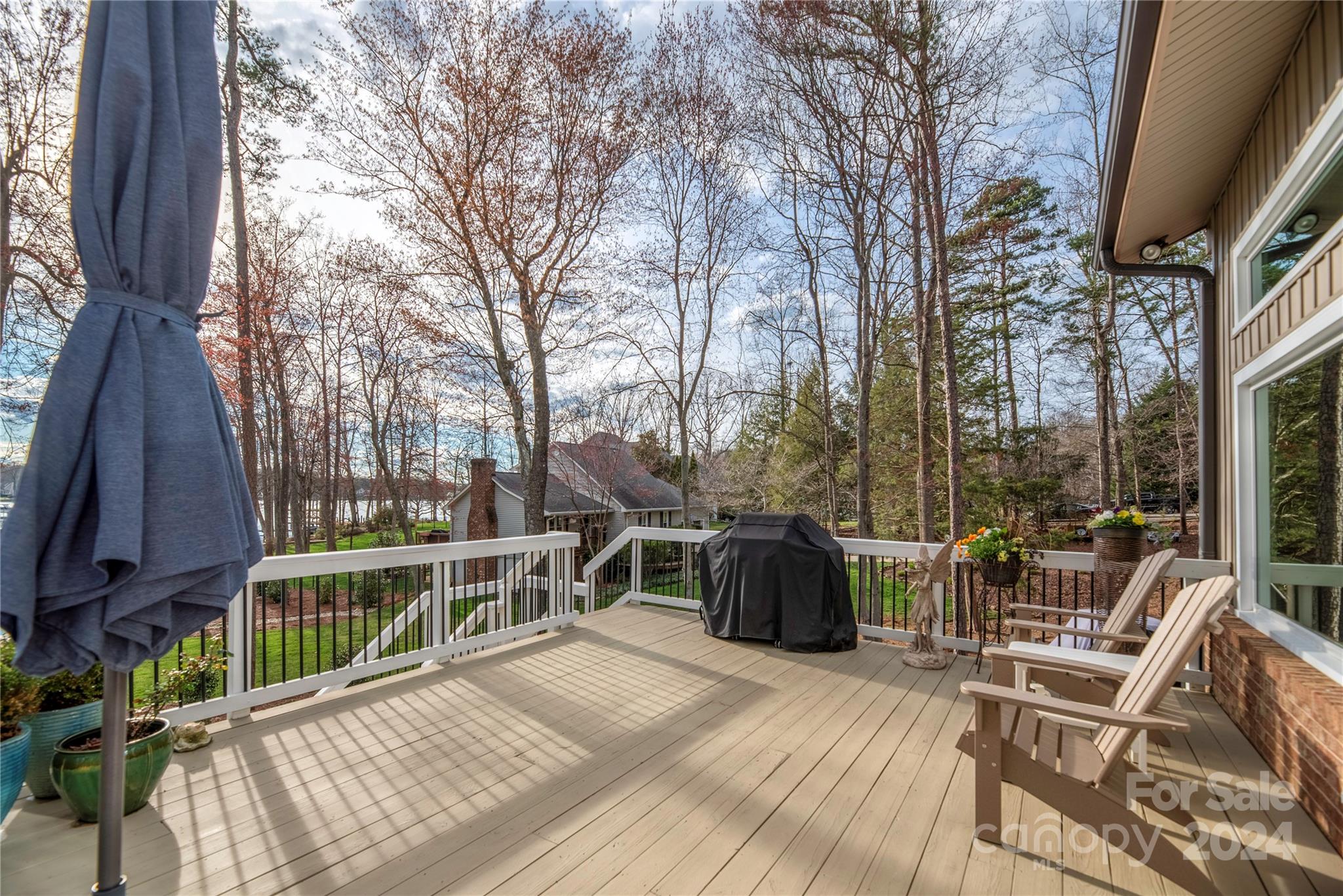 21525 Sandy Cove Road Cornelius, NC 28031 - Photo 26 of 35 a view of a deck with couches and wooden floor